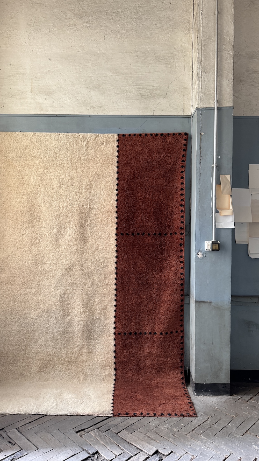 Handwoven Moroccan rug from the ‘Intersection’ collection by Studio KO for Beni Rugs, shown at 5Vie during Milan Design Week. 