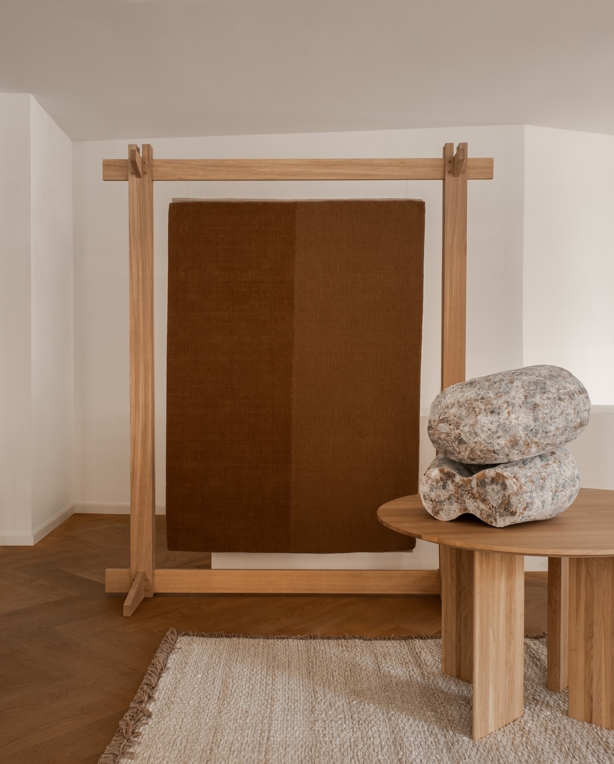 Echoes of Texture exhibition by Linie Design and Karimoku Case at 3 Days of Design 2025, featuring handwoven rugs from the Woven Matter collection displayed on wooden frames inspired by Japanese Shinto gateways, with contributions from Norm Architects, Urd Moll Gundermann, Foster + Partners, and Keiji Ashizawa Design