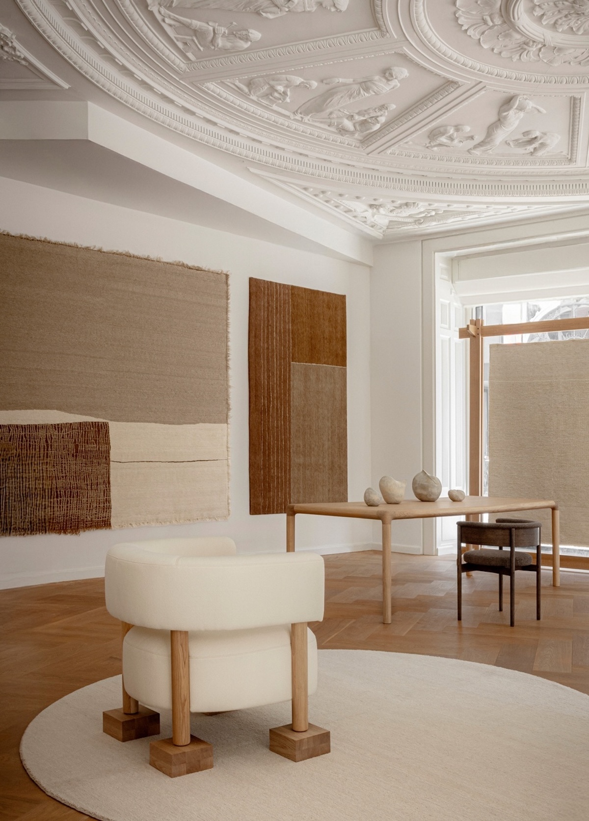 Echoes of Texture exhibition by Linie Design and Karimoku Case at 3 Days of Design 2025, featuring handwoven rugs from the Woven Matter collection displayed on wooden frames inspired by Japanese Shinto gateways, with contributions from Norm Architects, Urd Moll Gundermann, Foster + Partners, and Keiji Ashizawa Design