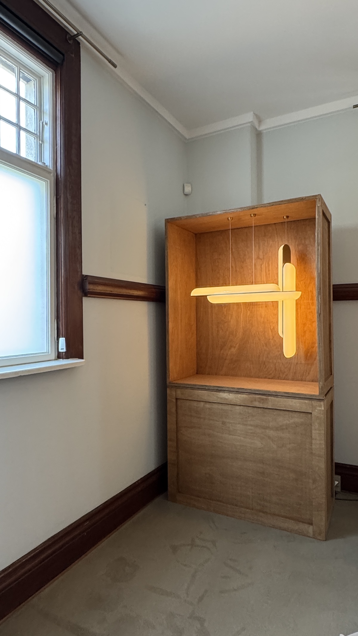 Lee Broom at Asia House during the exhibition, surrounded by minimalist design and curated objects.