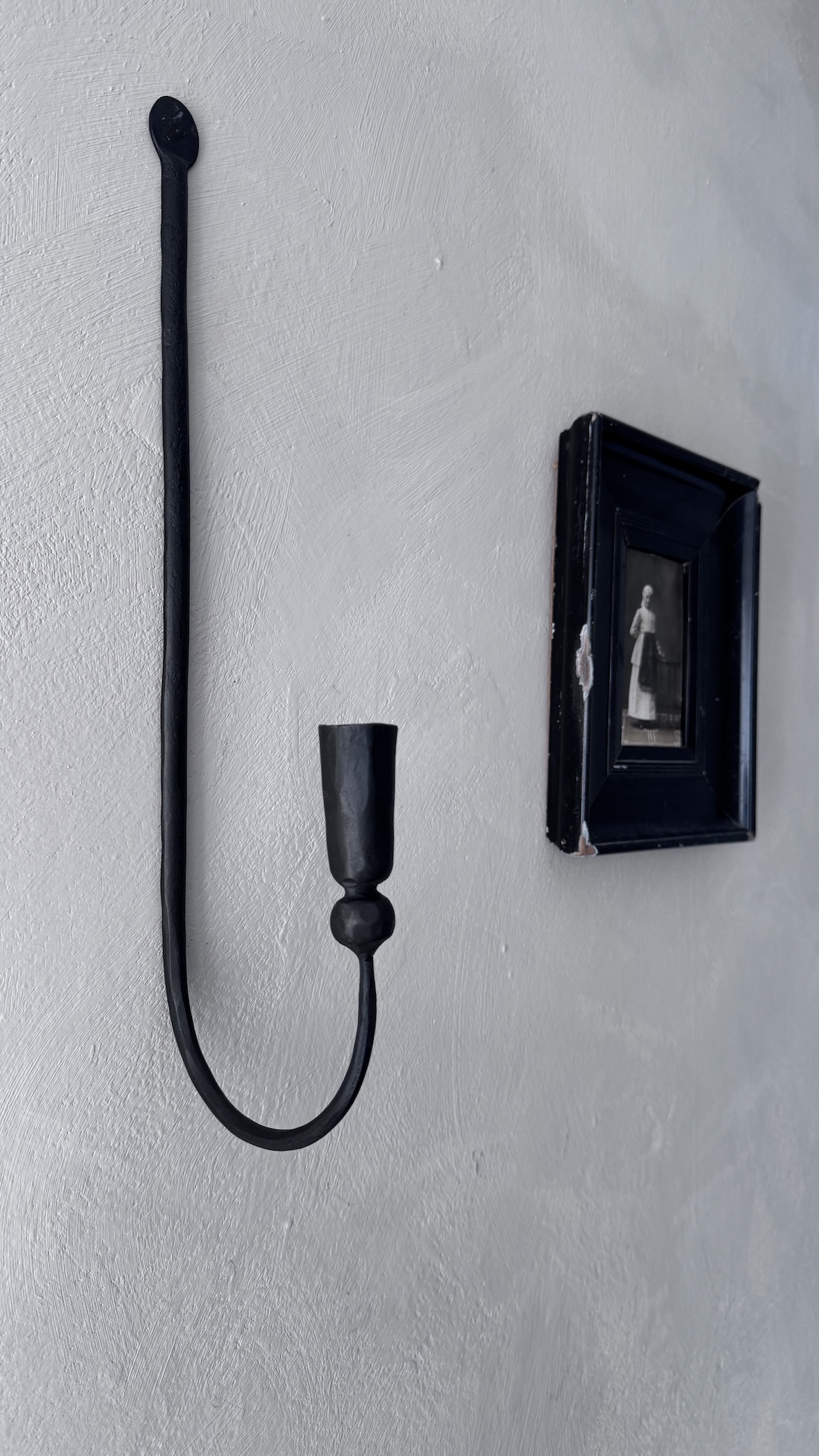 Iron wall candle holder at the home of vosgesparis